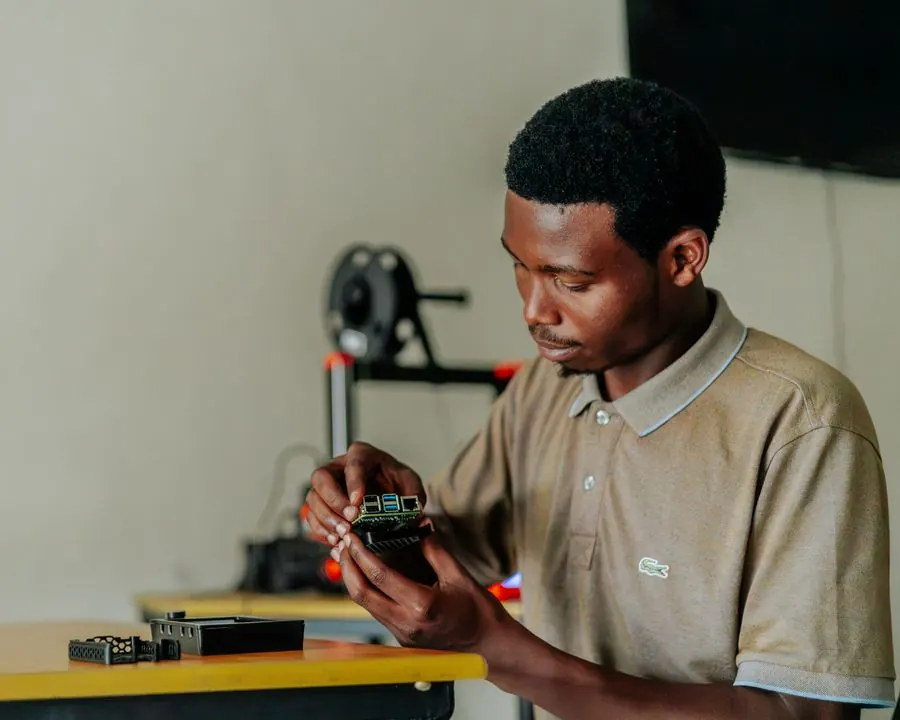 An engineer assembling an electronic circuit board